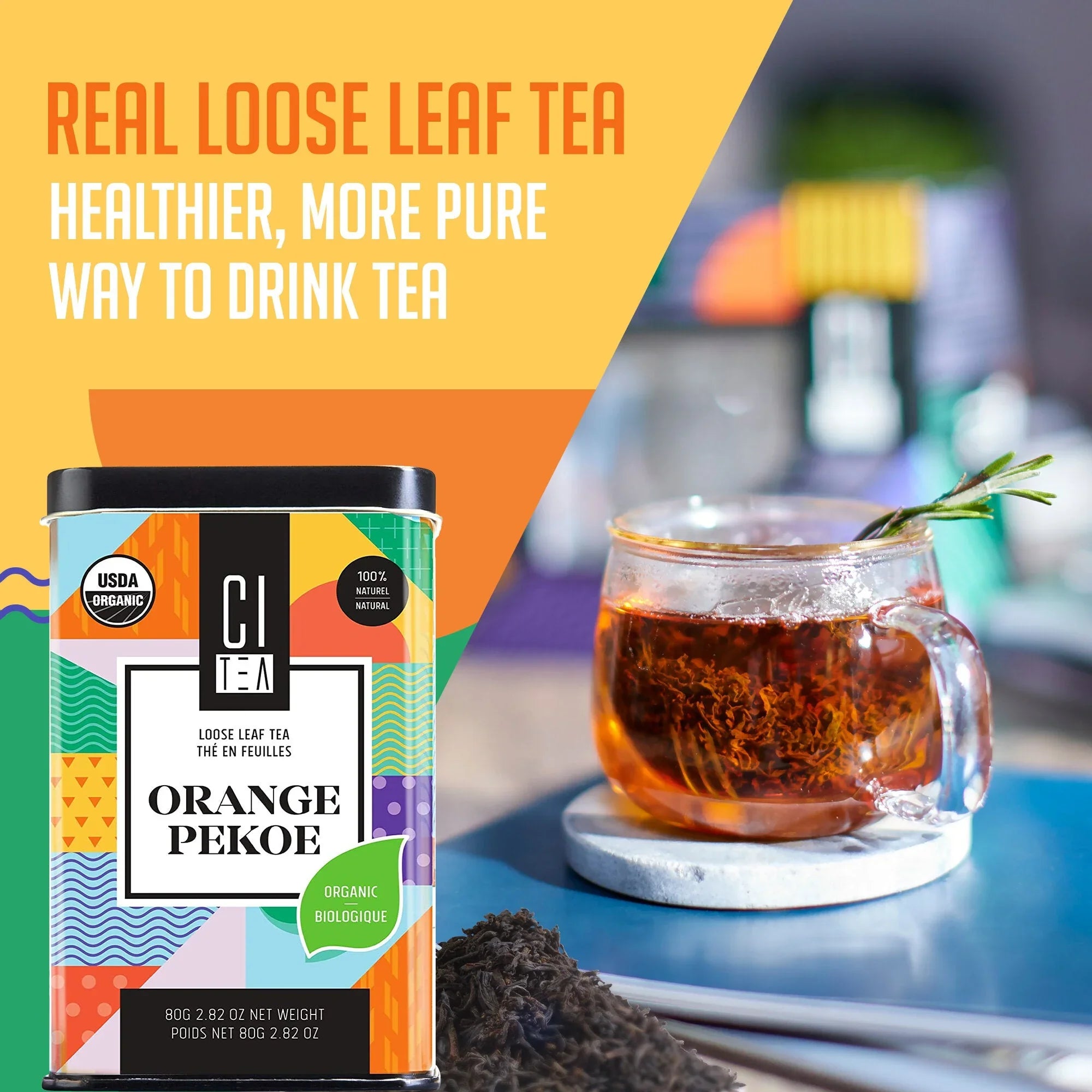 Citea Orange Pekoe organic loose leaf tea tin, glass cup of tea, and loose tea leaves on table