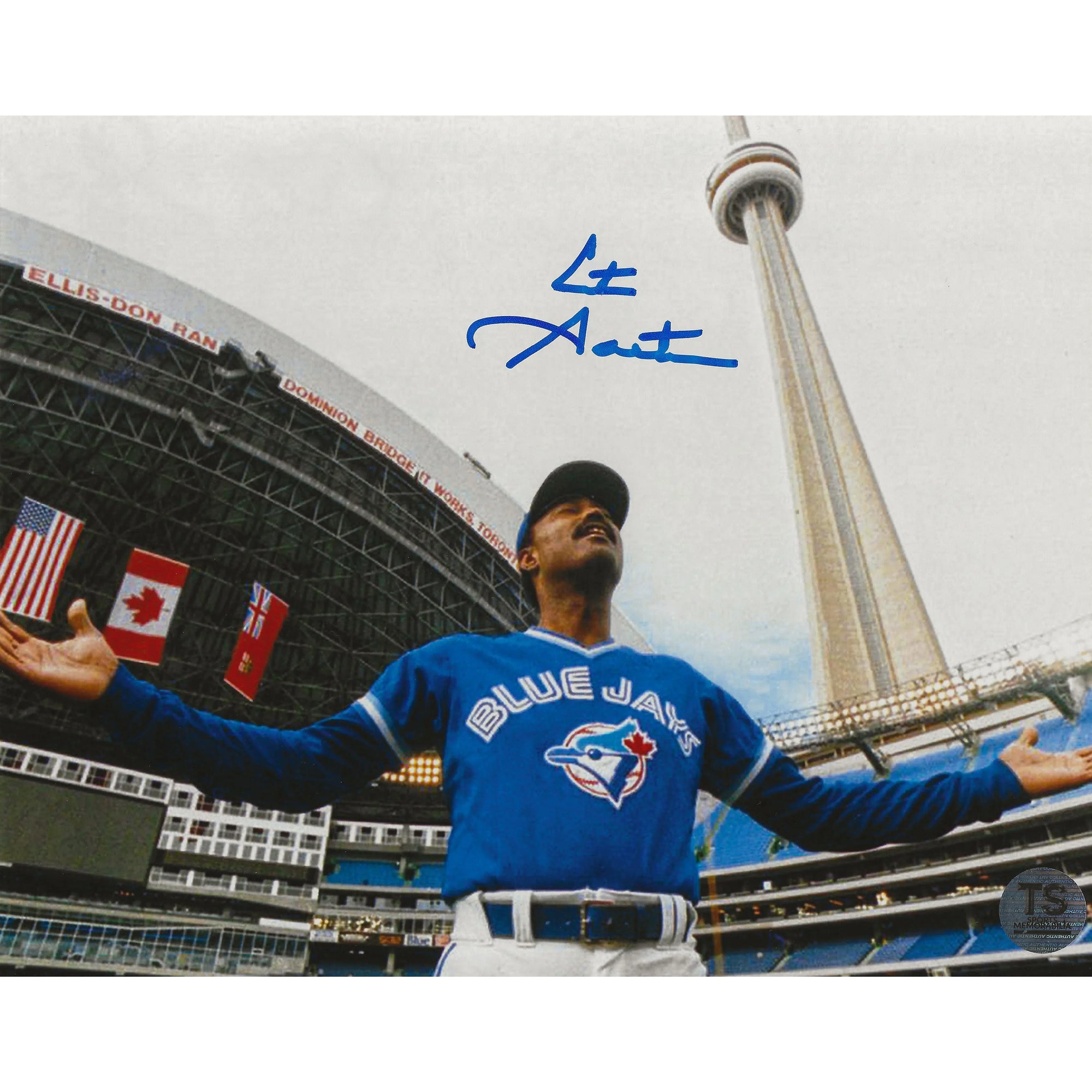 Toronto Blue Jays player at Rogers Centre with CN Tower and stadium flags, signed photo
