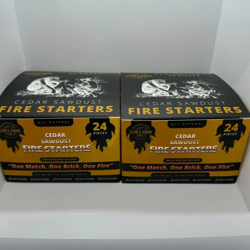 Two boxes of all natural cedar sawdust fire starters, 24 pieces, on a white shelf.