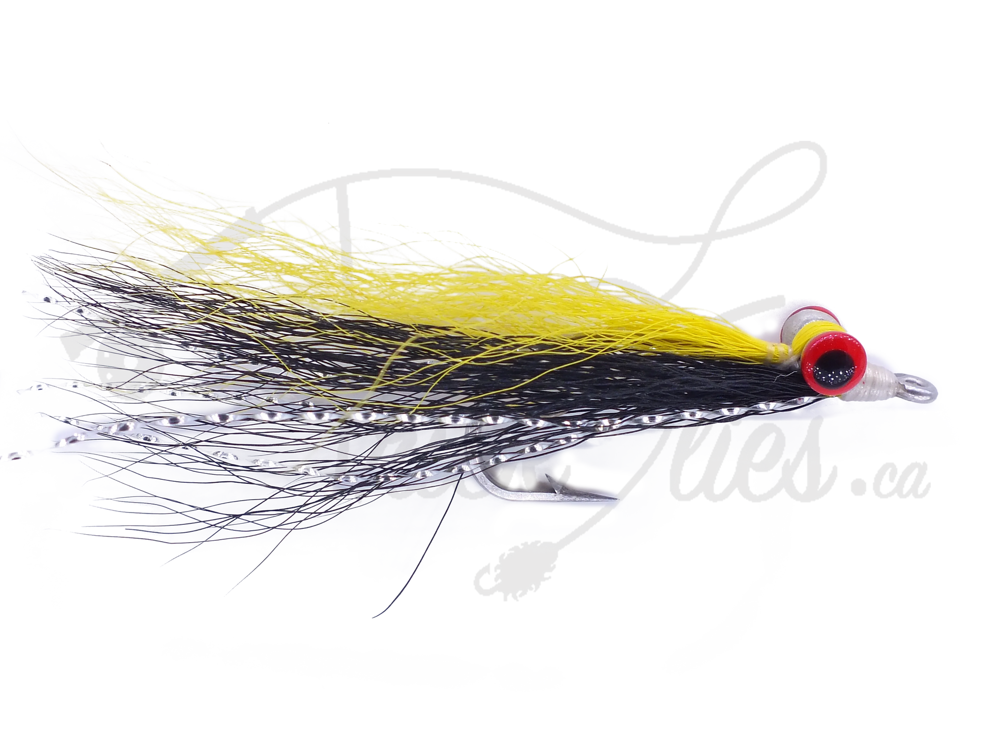 Clouser Minnow yellow and black fishing fly with red dumbbell eyes on white background