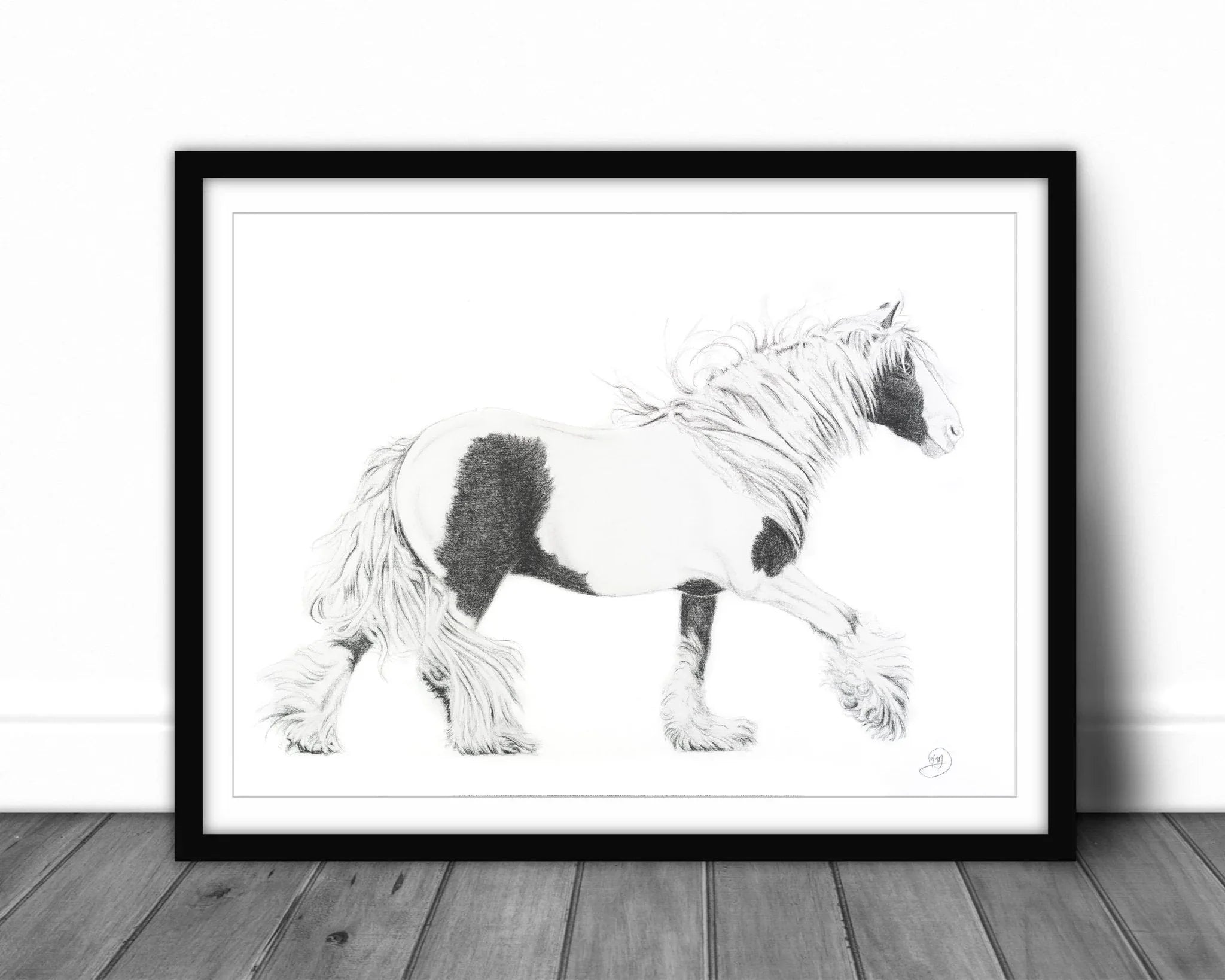 Black and white drawing of a Gypsy Cob horse in a frame on a wooden floor.