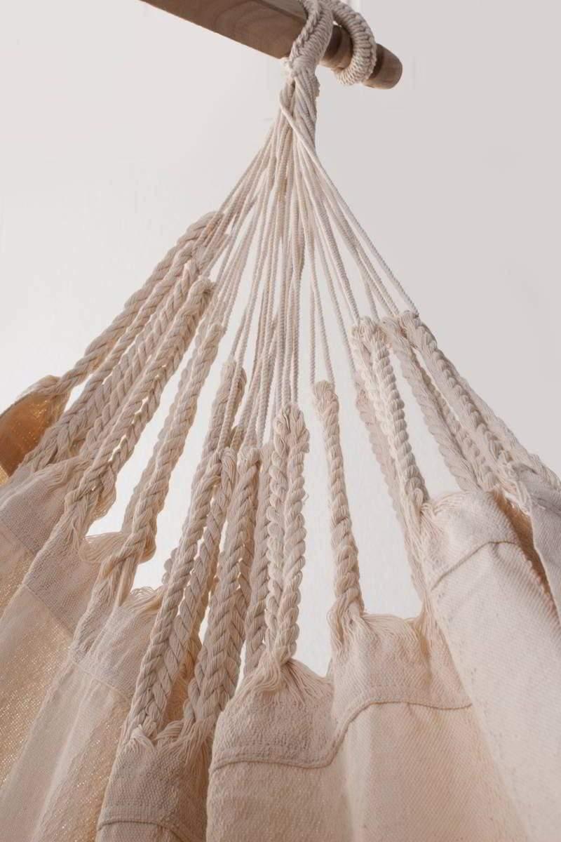 Colombian hanging chair in ecru cotton with braided rope details on wooden bar