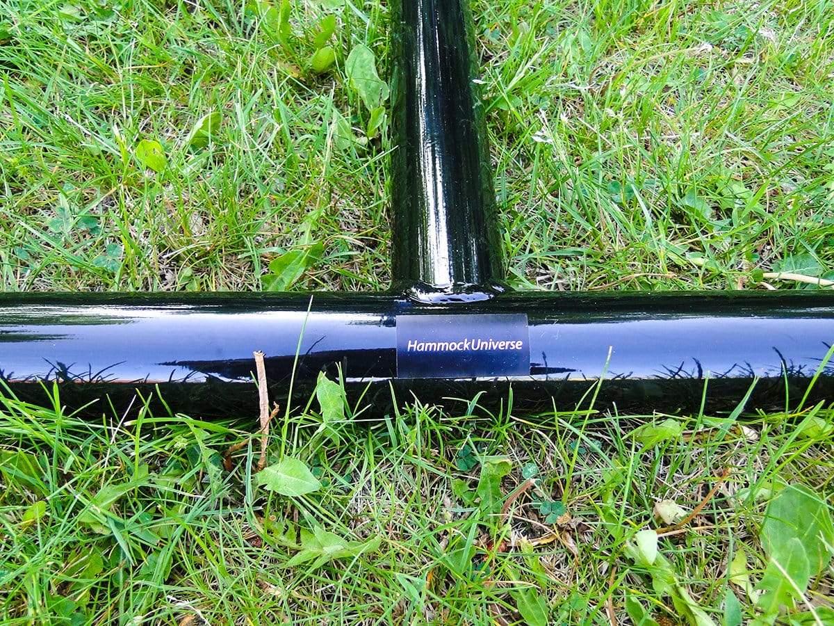 Hammock chair stand metal frame base on grass, Hammock Universe branding visible
