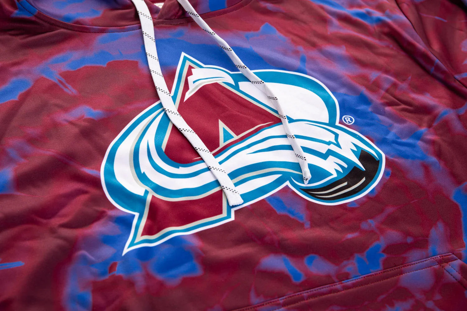 Colorado Avalanche logo on maroon and blue sublimated hoodie with white drawstrings