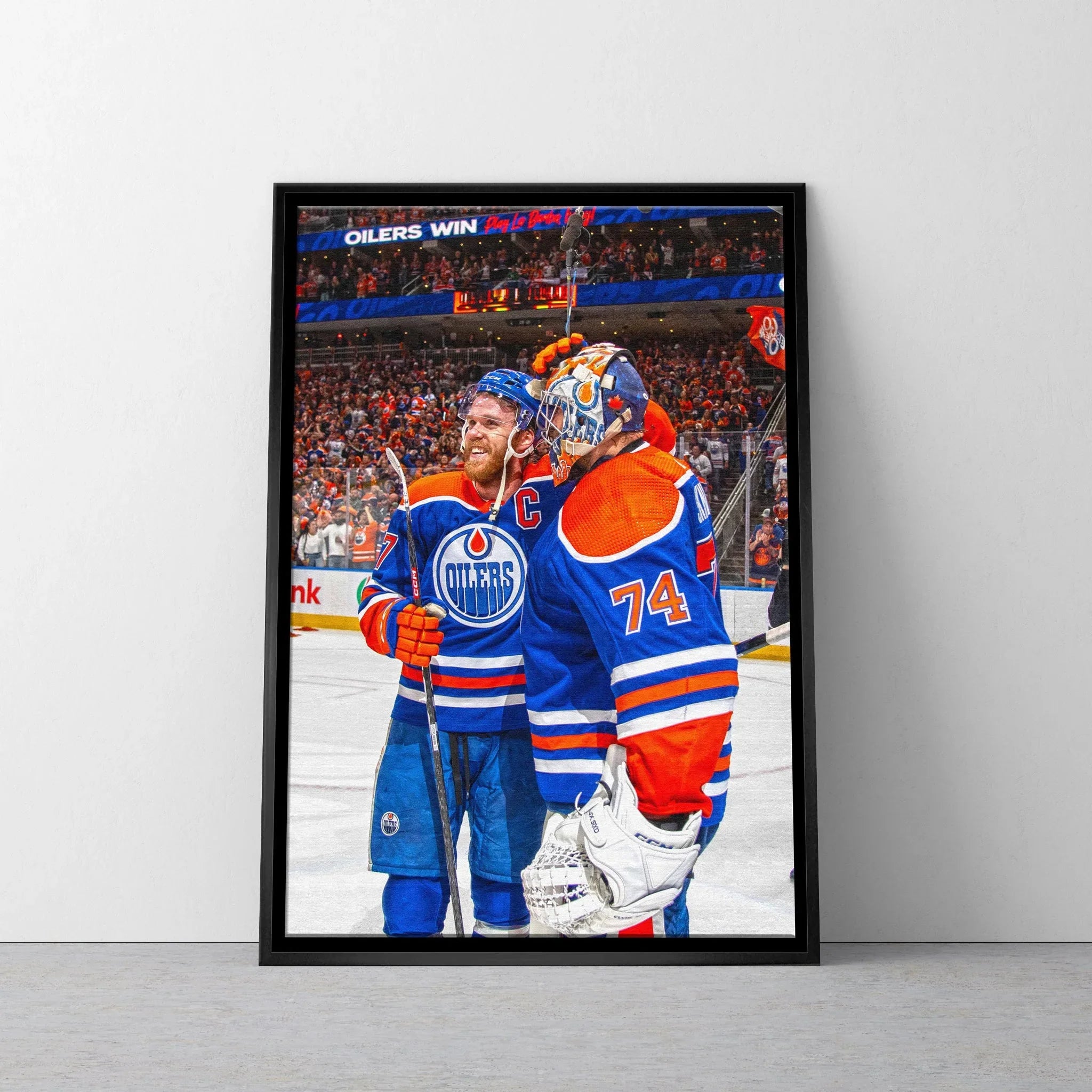 Framed poster of two Edmonton Oilers hockey players celebrating on ice rink