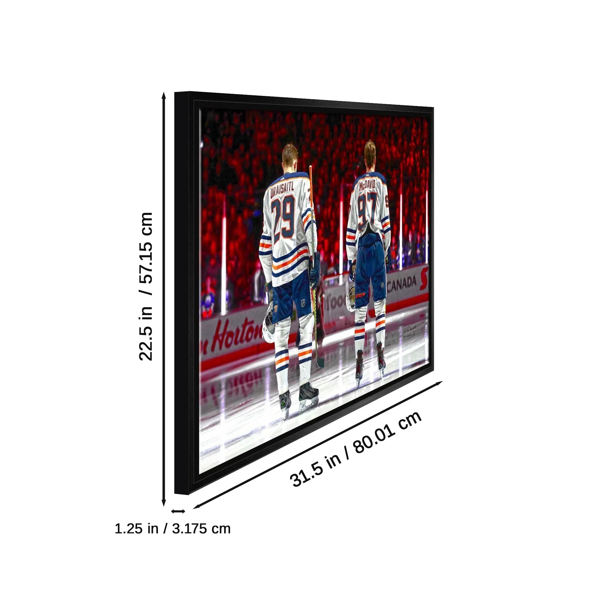 Framed hockey wall art with two players on ice in arena, dimensions labeled in inches and cm