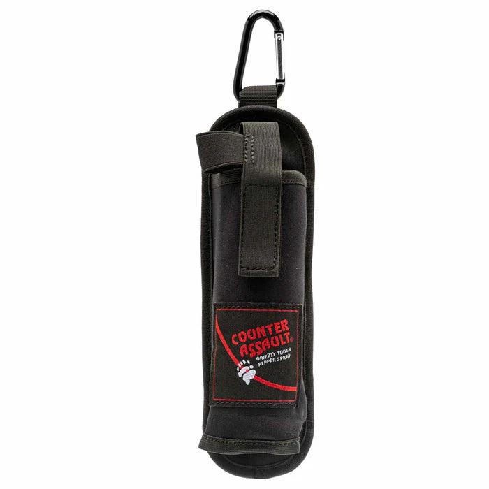 Black backpacker cross draw holster with carabiner and Counter Assault logo, studio background