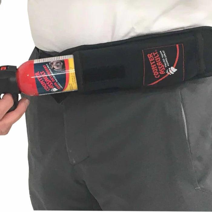Counter Assault bear spray holster worn on belt, shown in studio close-up