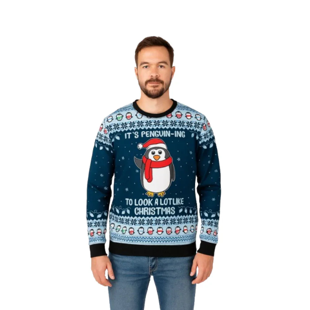 Man wearing blue Christmas sweater with cartoon penguin, snowflakes, and festive text