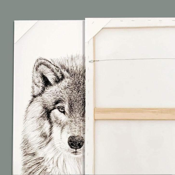 Half wolf face black and white sketch on canvas, next to a blank canvas back, minimalist art