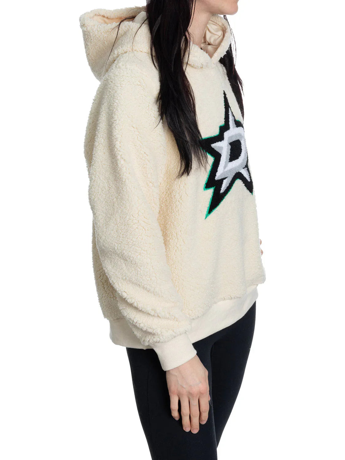 Woman wearing cream Dallas Stars sherpa hoodie with embroidered star logo, side view