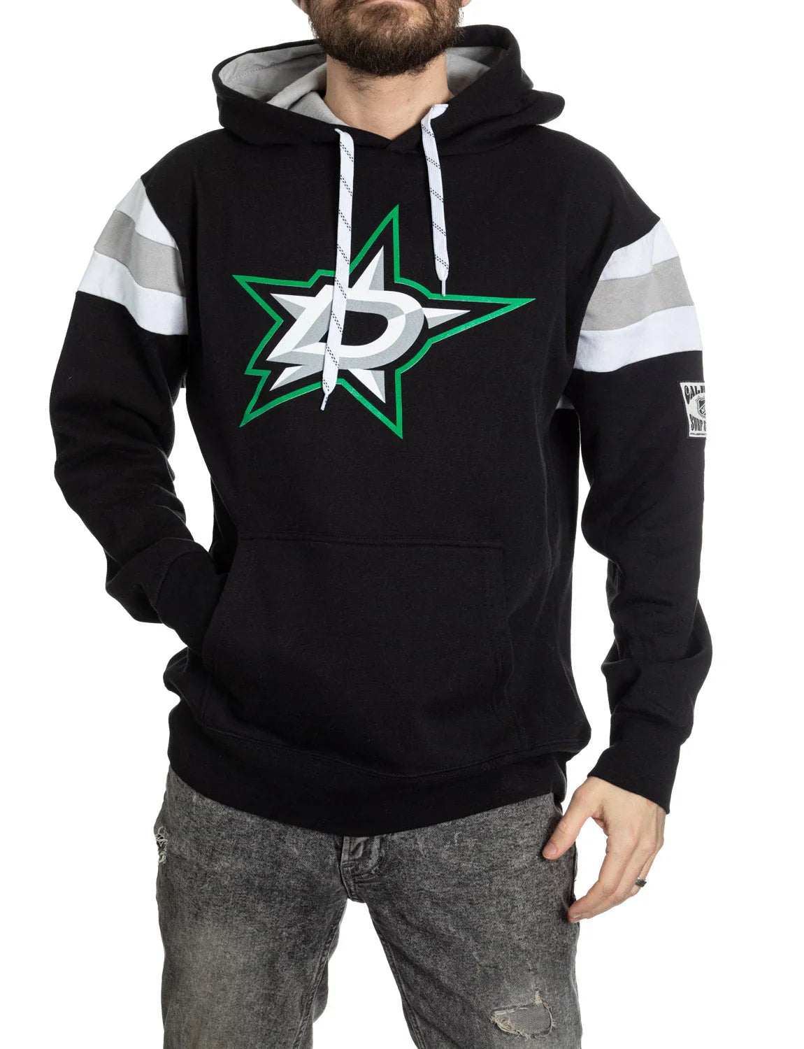 Man wearing black Dallas Stars varsity hoodie with logo, gray sleeve stripes, and jeans