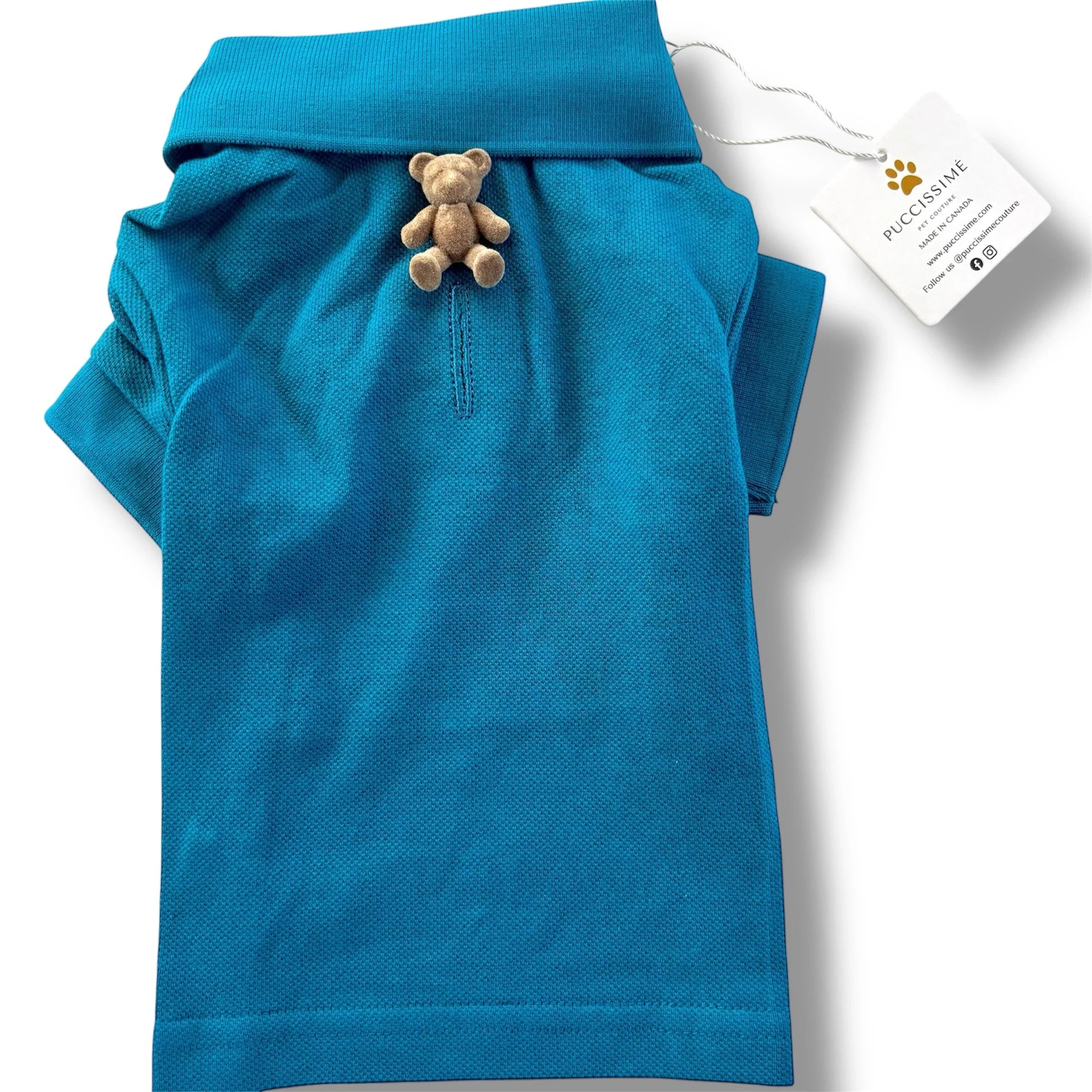 Blue dog polo shirt with teddy bear button and Puccissime brand tag