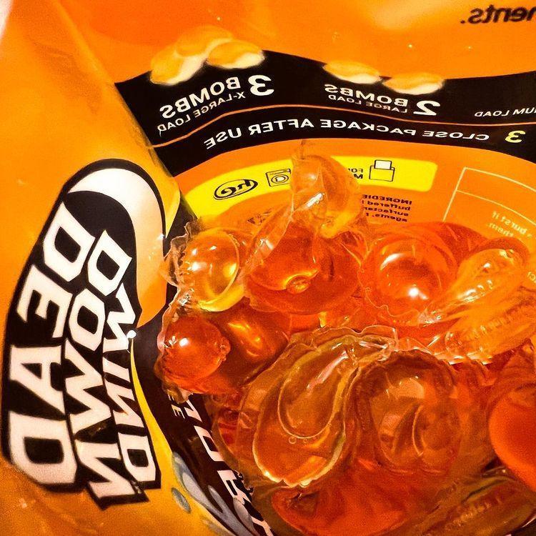 Dead Down Wind Laundry Bombs 28-pack orange detergent pods in open package