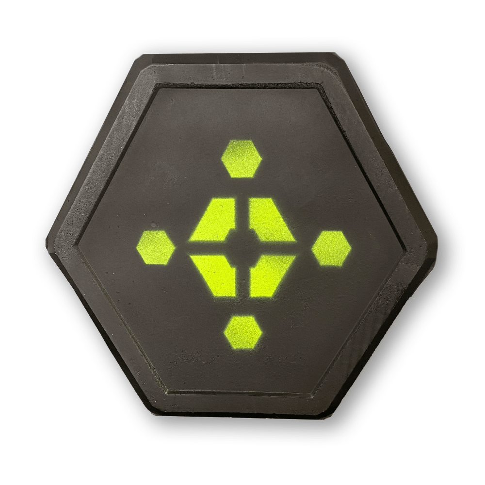 Hexagonal black tile with bright yellow geometric pattern center and white background