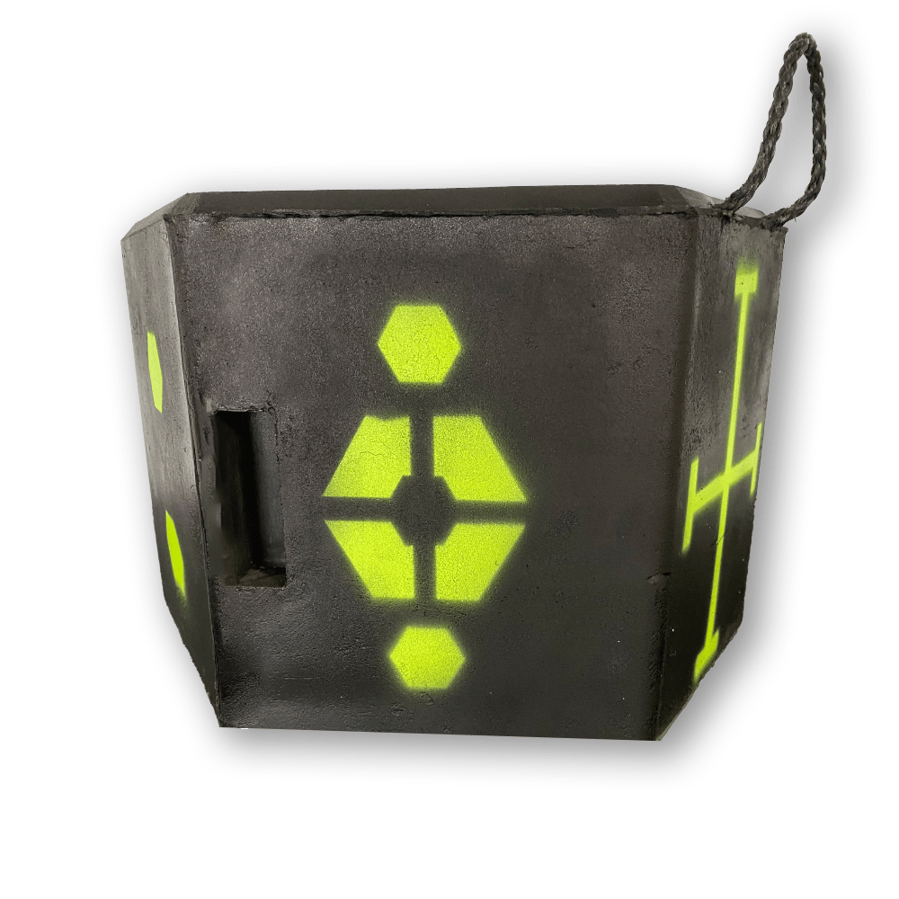 Black cube with neon yellow geometric symbols and a braided rope handle