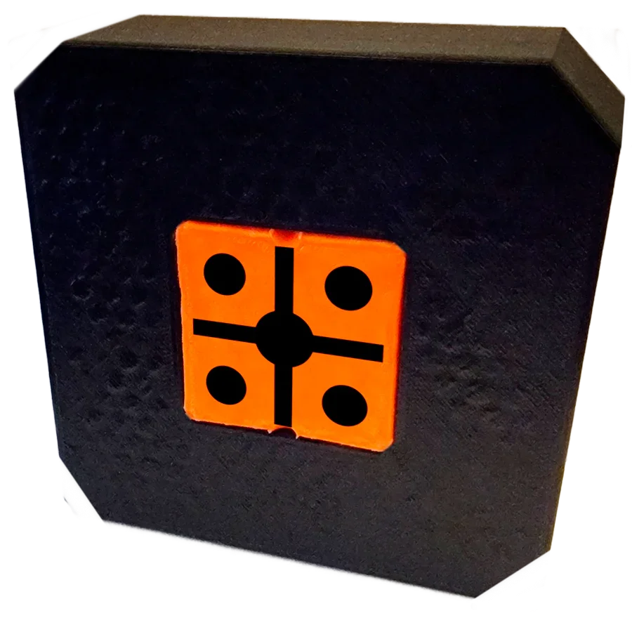 Black foam archery target block with orange and black bullseye target face