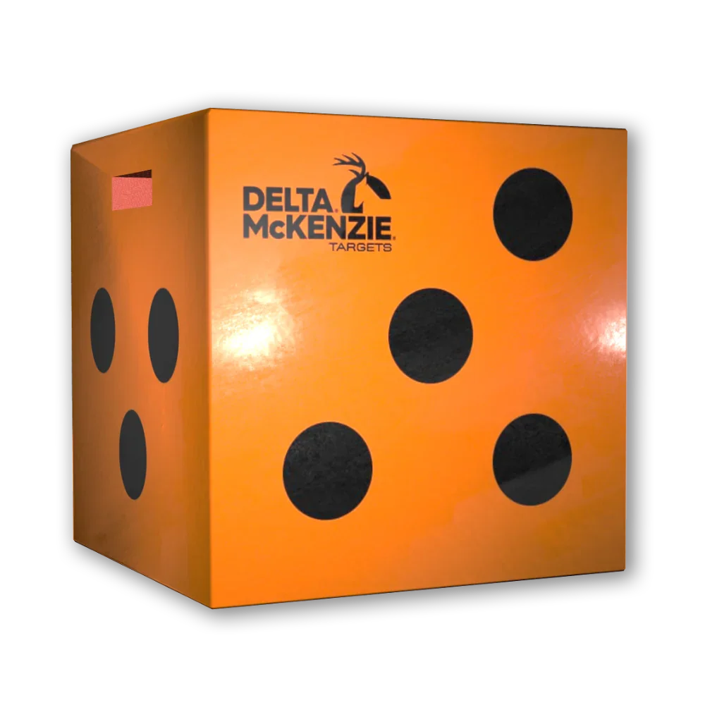Delta McKenzie orange archery target cube with black dots on a black background
