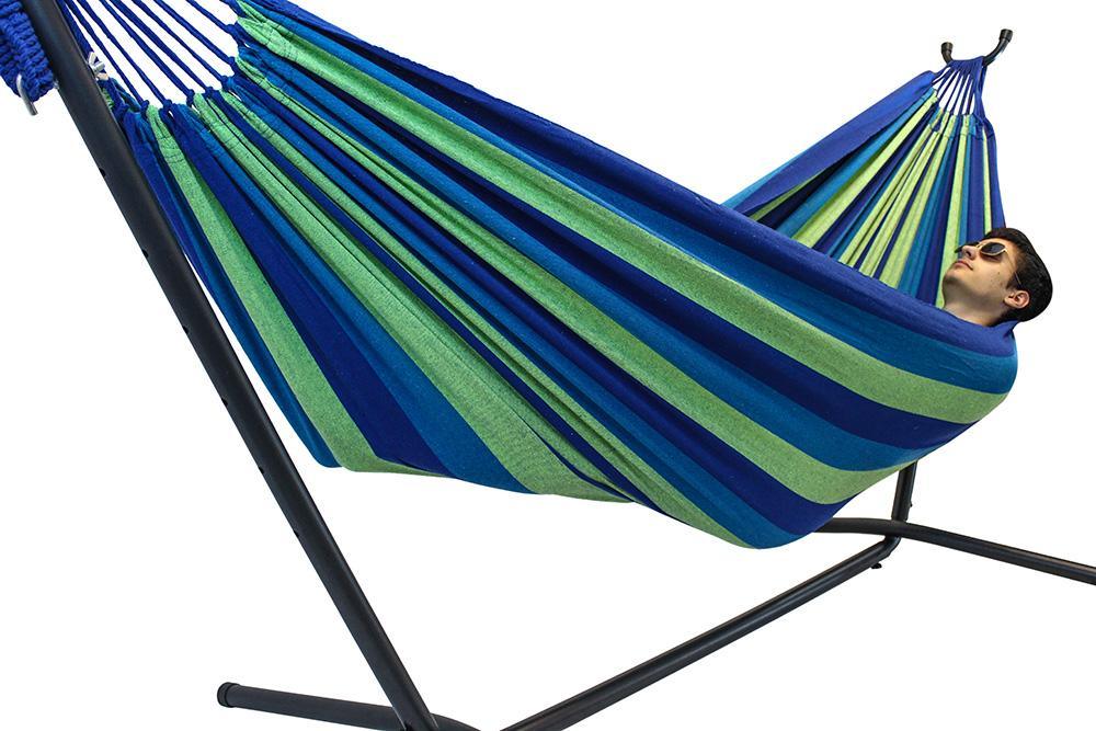 Brazilian double hammock with green and blue stripes on a black universal stand