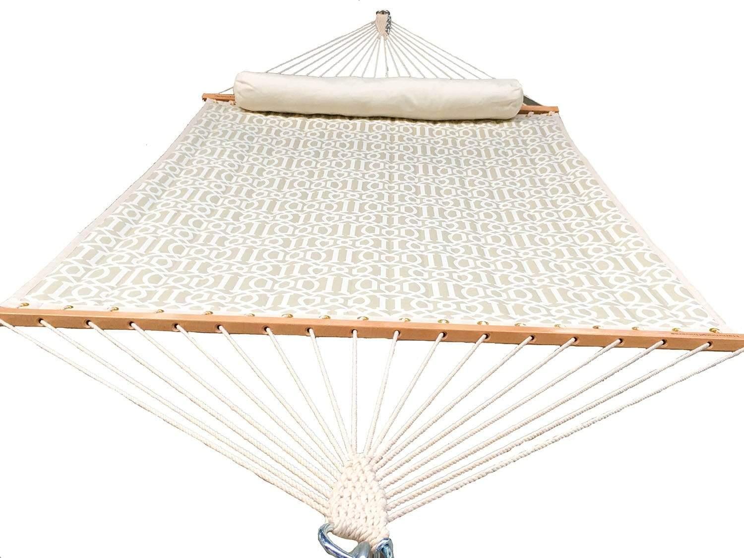 quilted double hammock in beige with patterned fabric, wooden spreader bars, and head pillow