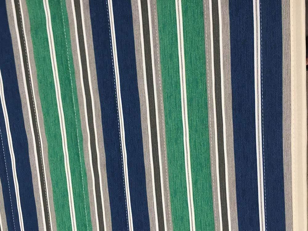 Quilted hammock fabric with green, blue, grey, and white vertical stripes