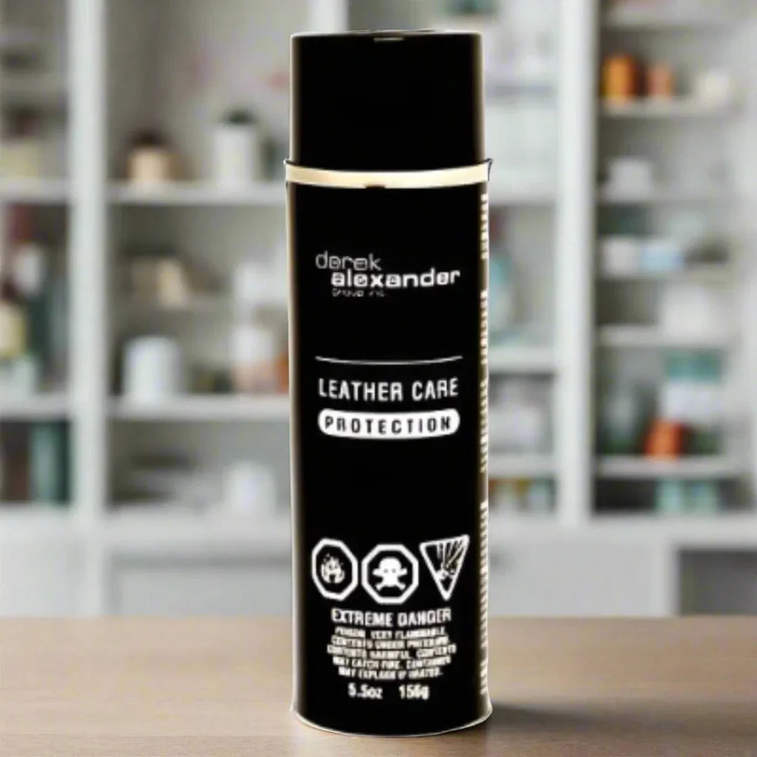 Derek Alexander travel size leather care protection spray can on a wooden table indoors