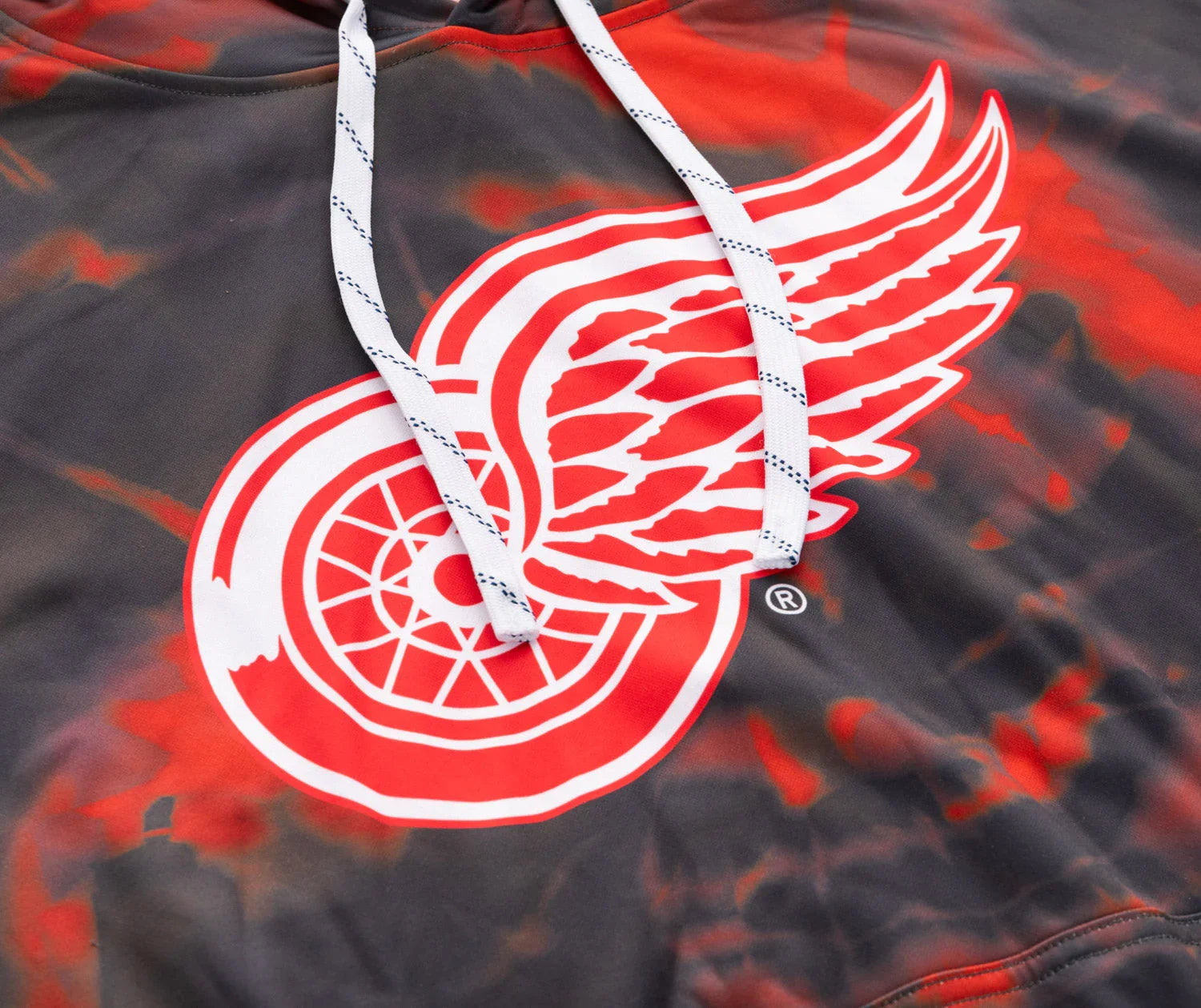 Detroit Red Wings logo on a black and red sublimation hoodie with white drawstrings