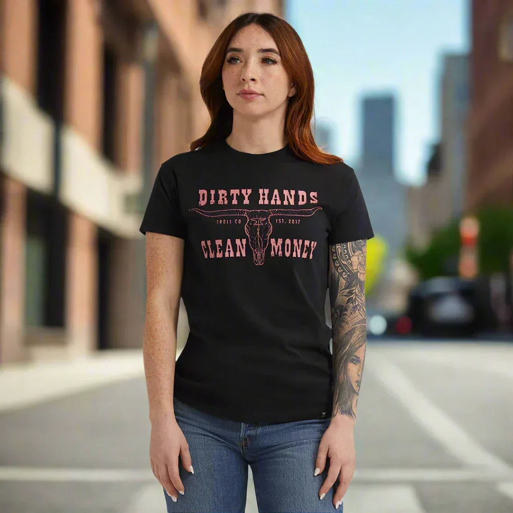 Woman wearing black Dirty Hands Clean Money t-shirt with longhorn graphic on city street