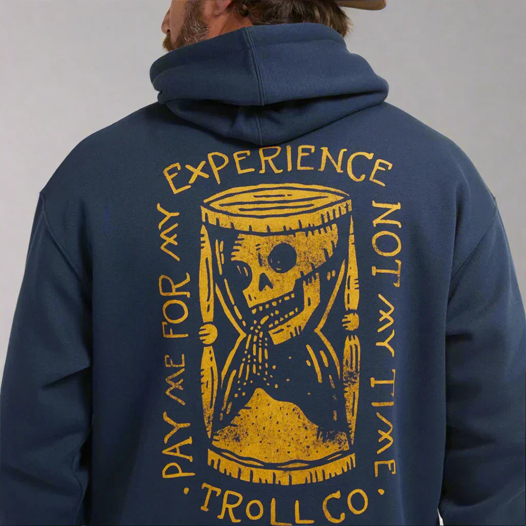 Navy hoodie with yellow hourglass skeleton graphic and 'Pay me for my experience not my time' text