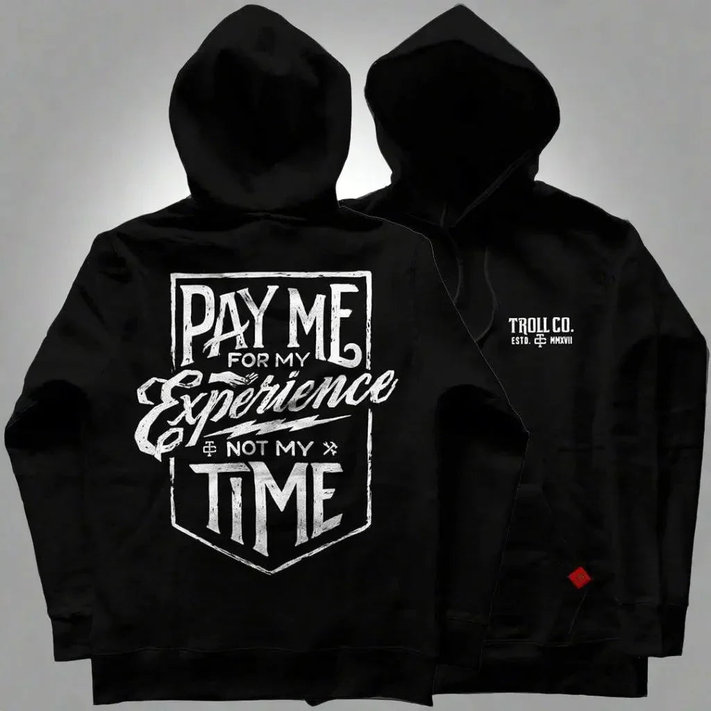 Black hoodie with bold white 'Pay Me For My Experience Not My Time' graphic and Troll Co. logo