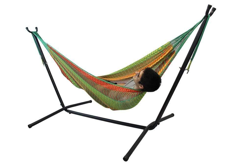 Double hammock with man relaxing, colorful fabric, on black universal stand