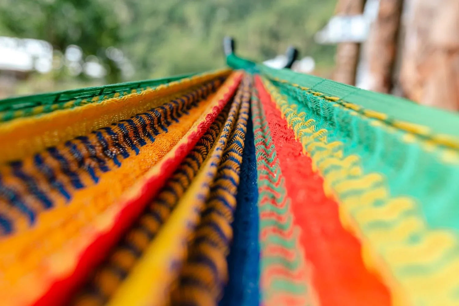 Close-up of colorful Mayan double hammock fabric on a universal stand outdoors