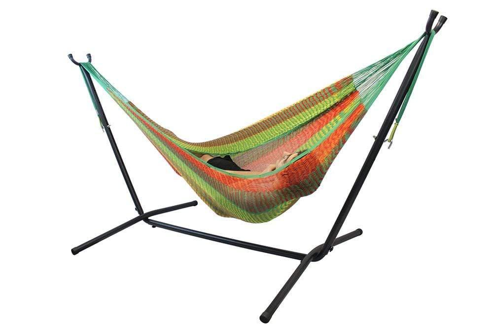 Double hammock with colorful fabric on a black universal stand, isolated on white.
