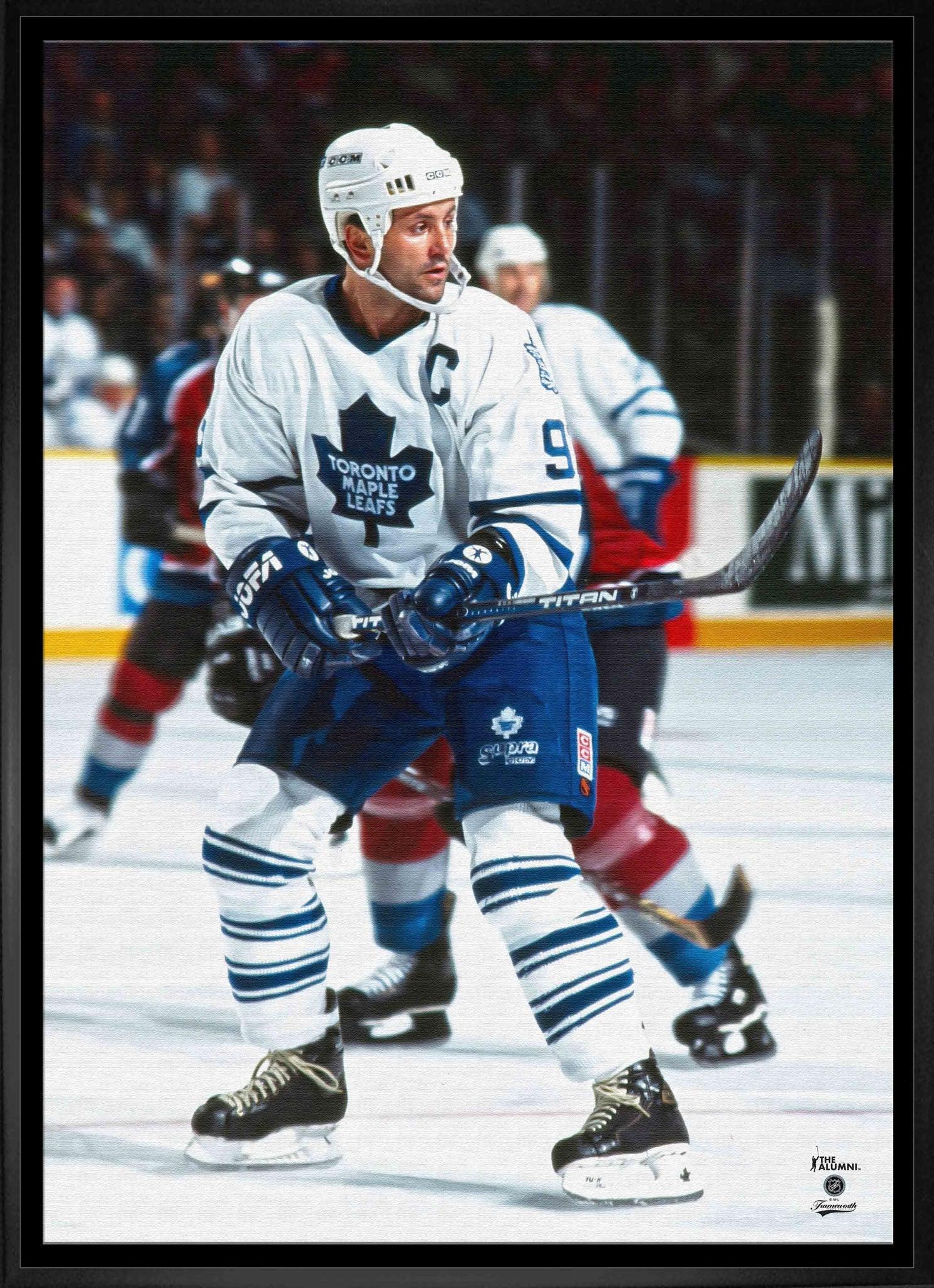 Toronto Maple Leafs hockey player in white jersey and helmet on ice during a game