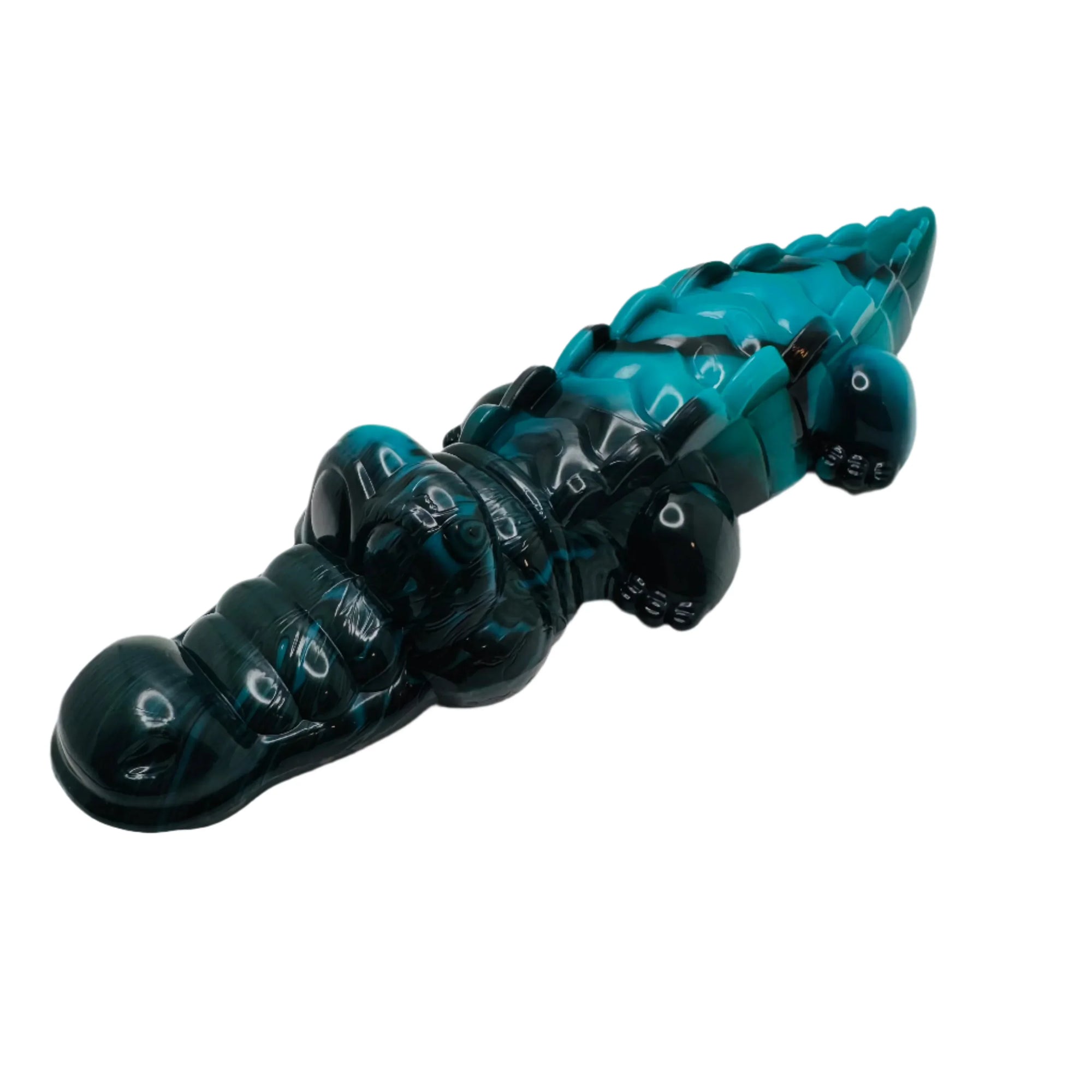 Blue and black crocodile dog chew toy on white background