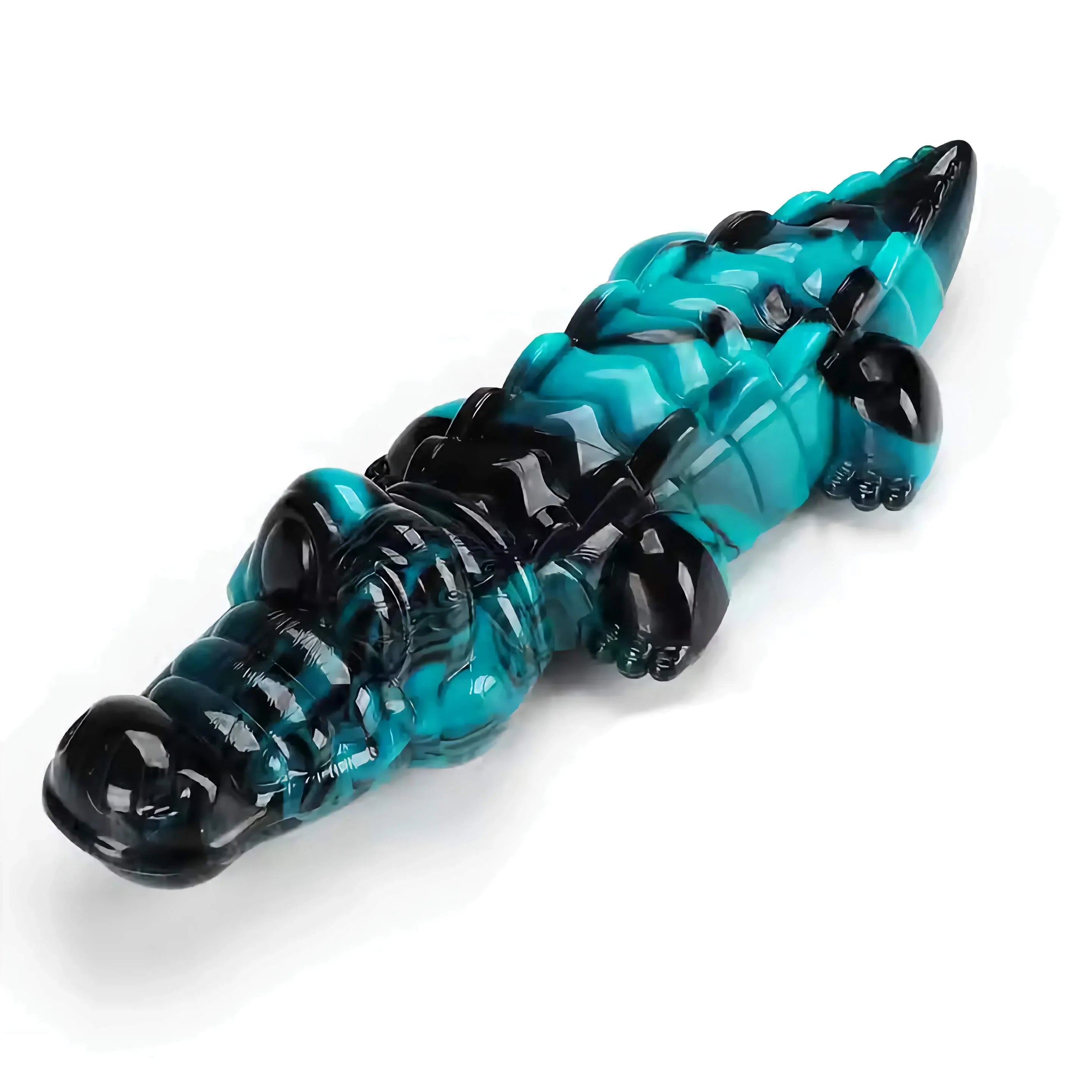 Blue and black glass alligator figurine on a white background