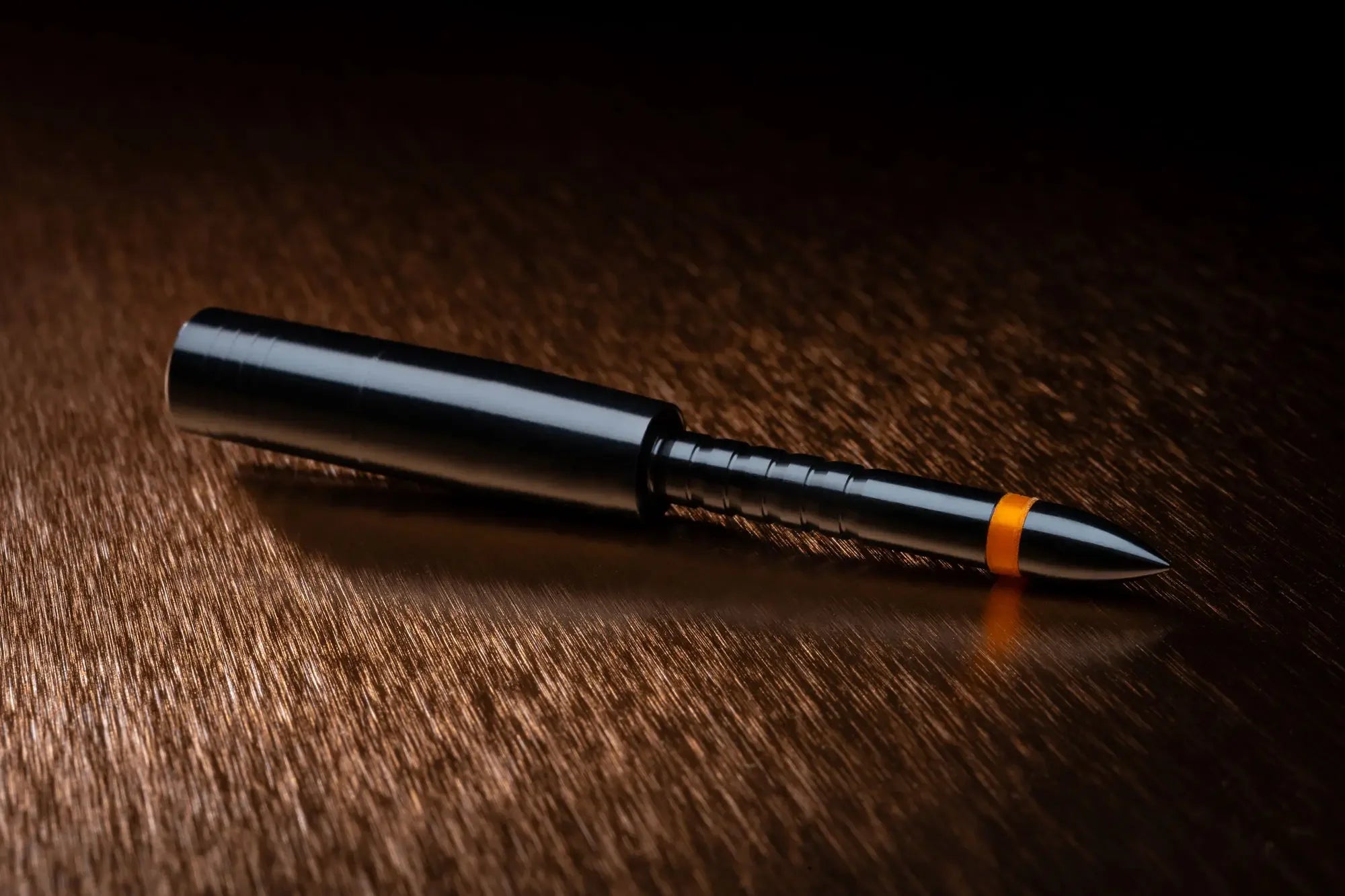 4mm Matchgrade Halfout 55gr arrow insert on metallic surface, black finish, orange ring