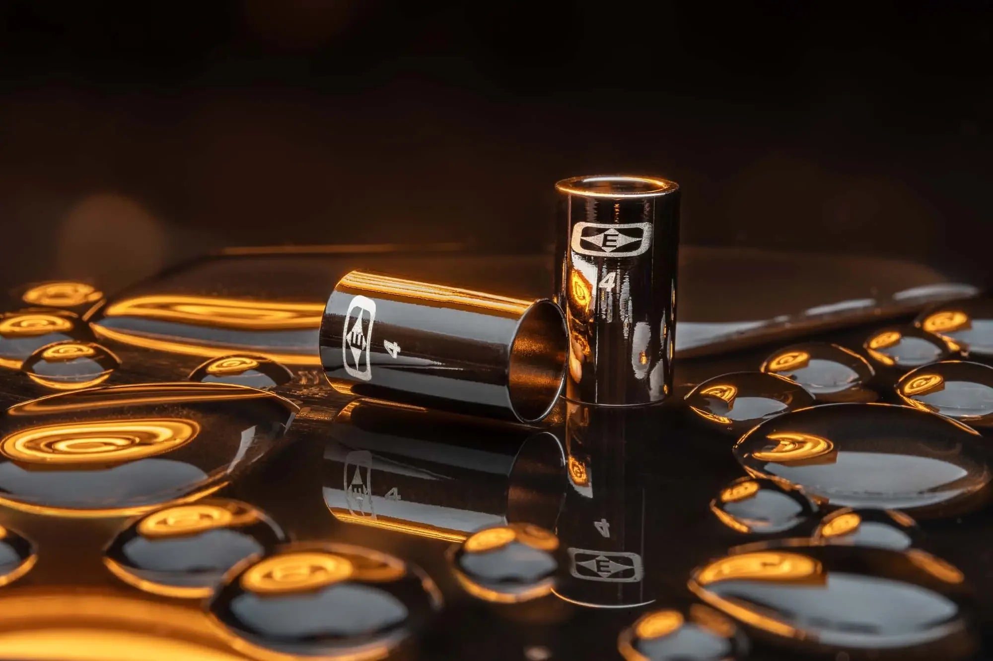 Match grade collar hardware on wet reflective surface with orange lighting