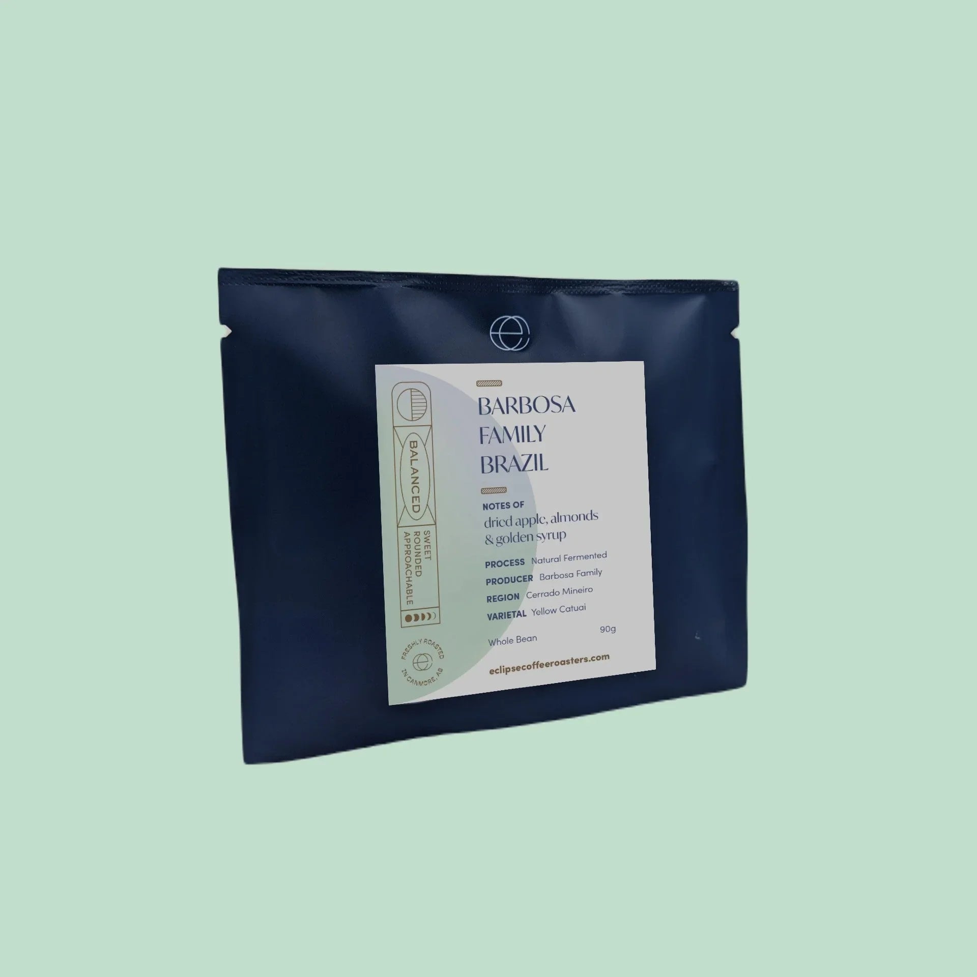 Barbosa Family Brazil coffee beans 90g in navy blue bag with label on light green background