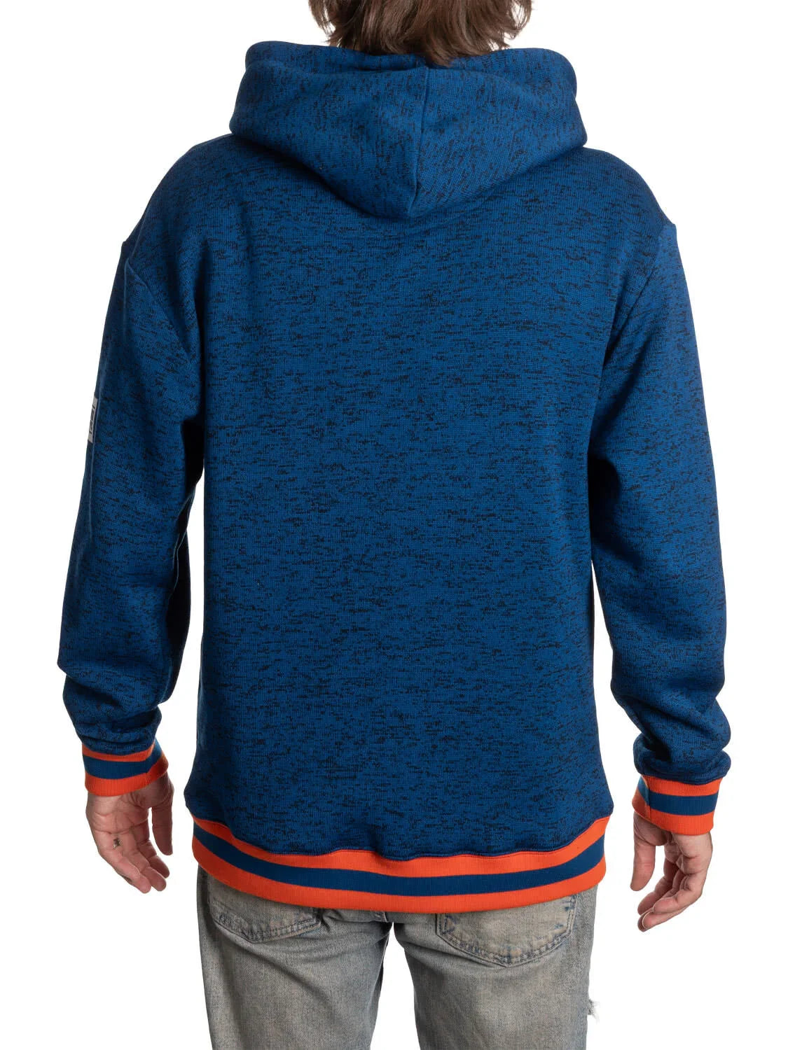 Back view of person wearing navy blue hooded Oilers sweater with orange trim and jeans