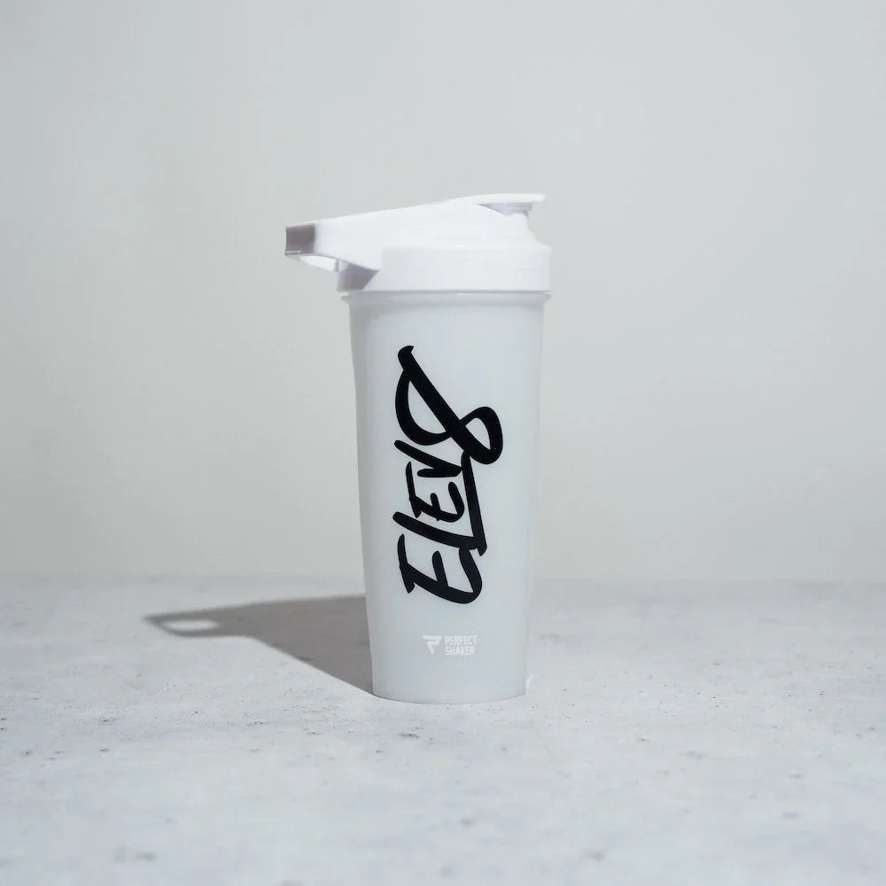 White ELEVB shaker bottle with black logo on a light marble surface