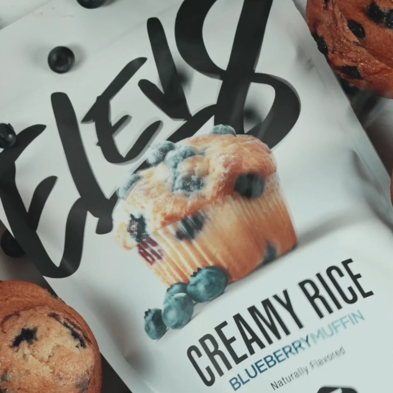 Creamy rice blueberry muffin flavored snack packaging with fresh blueberry muffins and blueberries