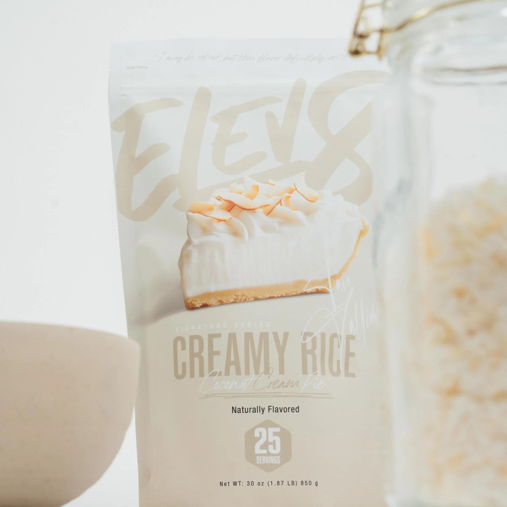ELEV8 Creamy Rice Coconut Cream Pie protein powder bag with coconut flakes jar