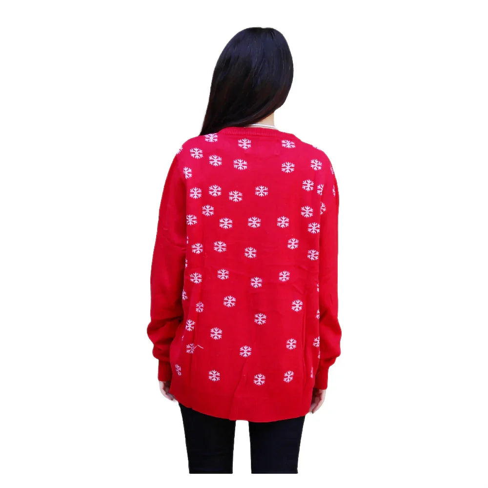Woman wearing red Christmas sweater with white snowflakes, back view