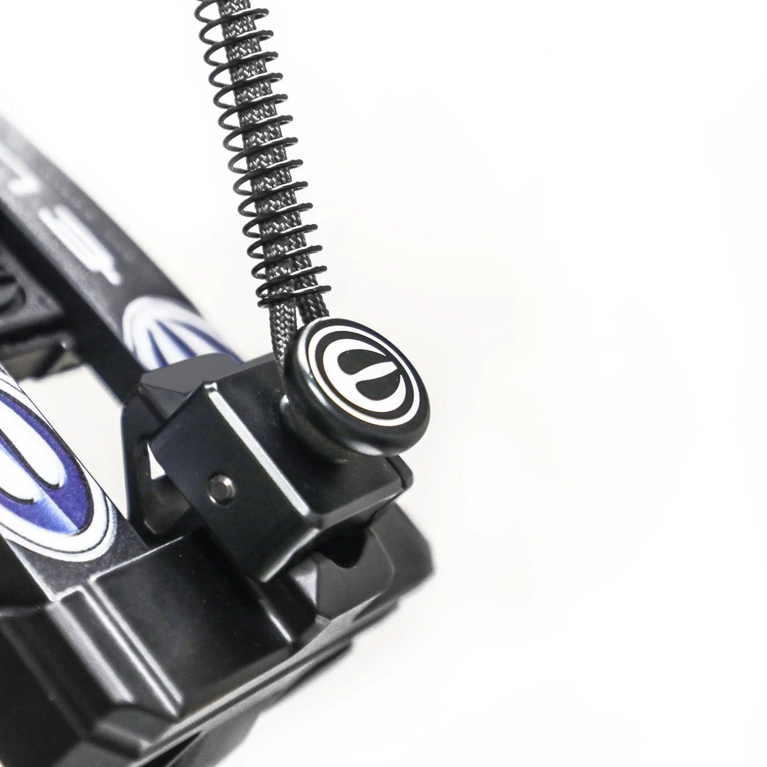 Close-up of a black archery bow quick disconnect mount with logo and tension spring cord