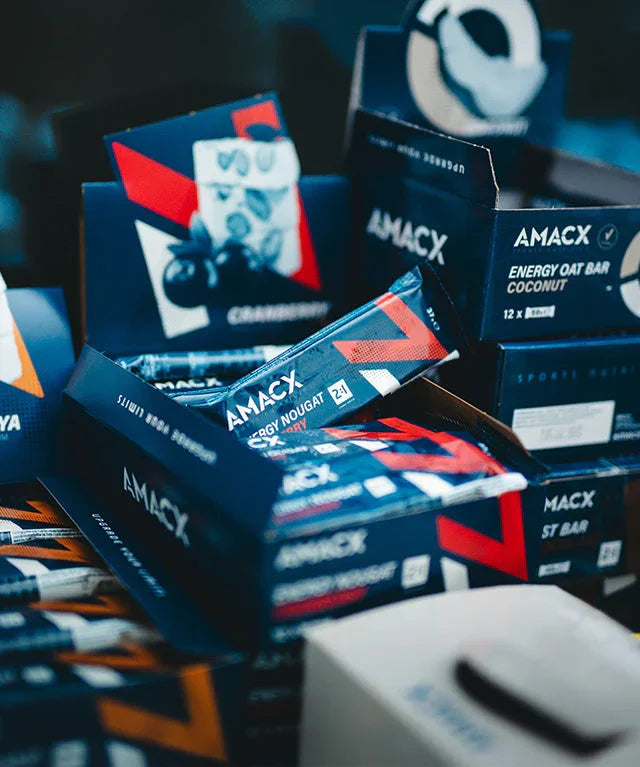 AMACX energy nougat cranberry bars in branded blue packaging, displayed in open boxes