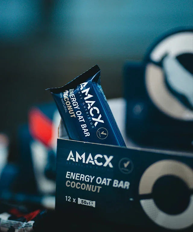 AMACX Energy Oat Bar Coconut flavor in blue packaging inside display box
