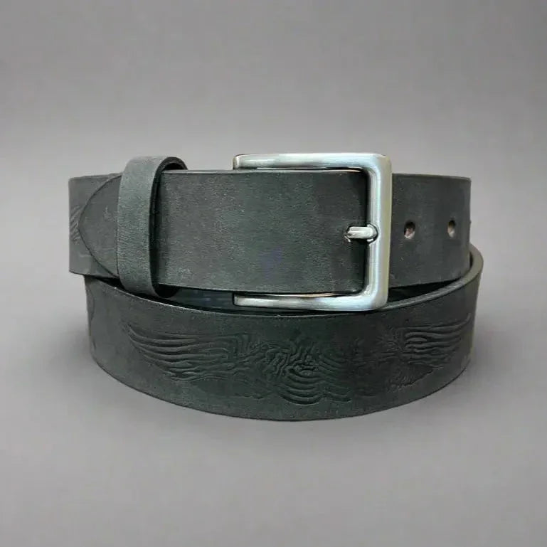 Black leather men's belt with eagle engraving and removable silver buckle on gray background