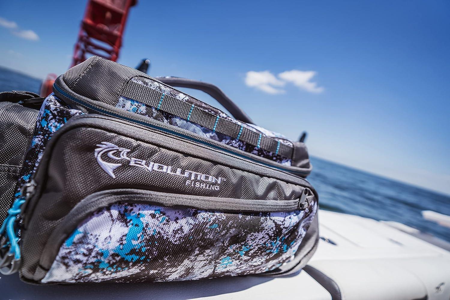 Evolution Fishing tackle bag with blue camo design on a boat by the ocean