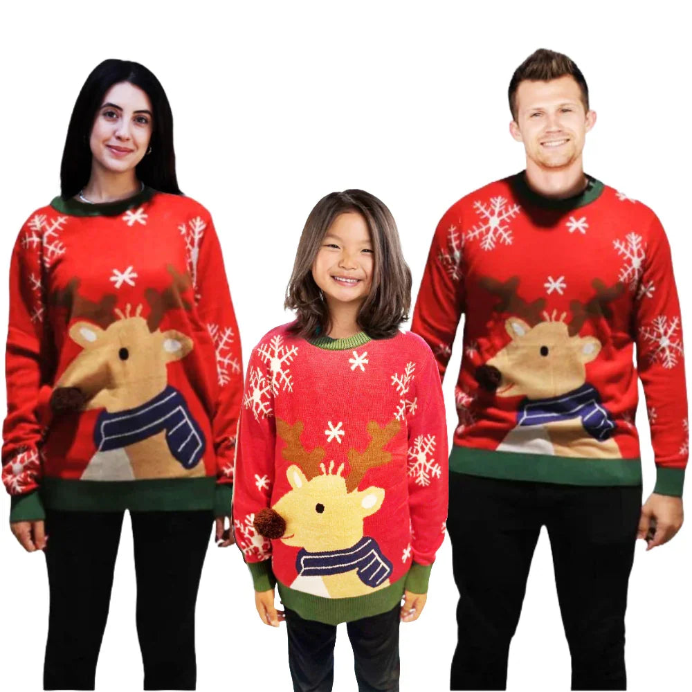 Family wearing matching red Christmas sweaters with reindeer and snowflake design